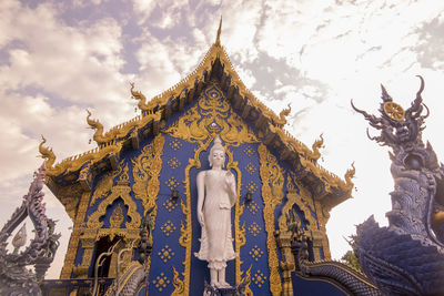 Low angle view of statue against building