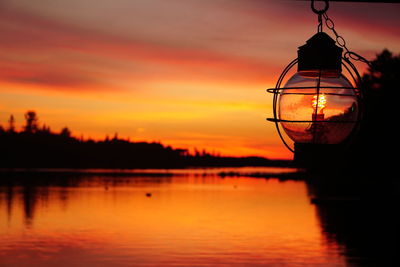 Scenic view of lake at sunset