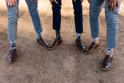 Low section of people standing on street