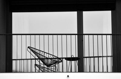 View of chair seen through window