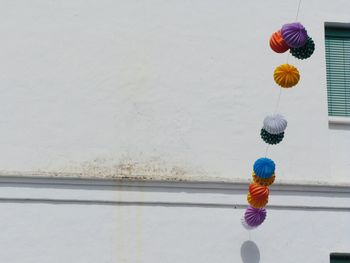 High angle view of toy hanging on wall