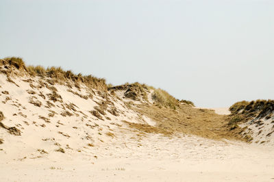 Scenic view of desert against clear sky