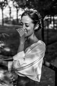 Smiling woman standing outdoors