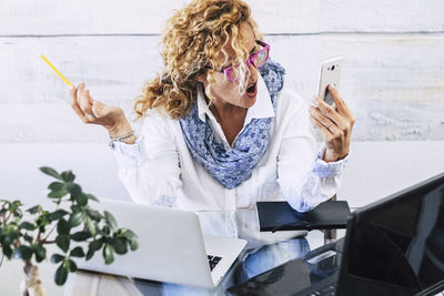 Woman holding mobile phone