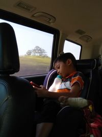 Man sitting in car