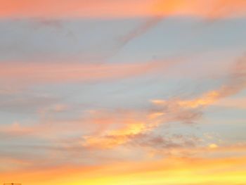 Low angle view of cloudy sky at sunset