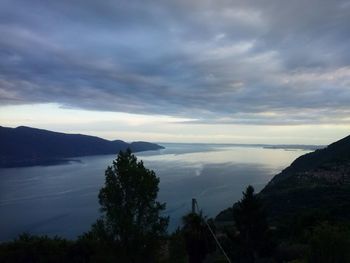 High angle view of calm sea against cloudy sky