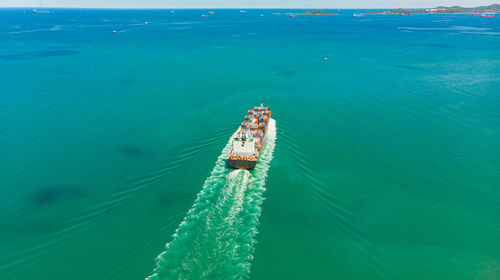 High angle view of boat sailing on sea