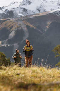 Rear view of man standing on mountain