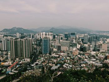 High angle view of buildings against sky in city