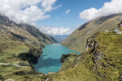 Scenic view of lake and mountains against sky