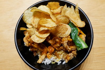 High angle view of chicken bowl in plate on table