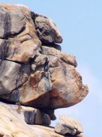 Low angle view of rock formation against clear sky