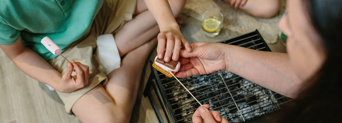 High angle view of people eating dessert