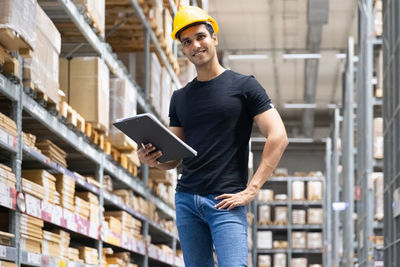 Full length of man working in building
