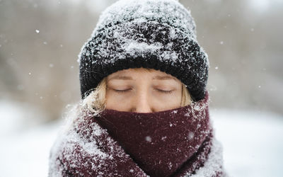 Close-up of woman face during winter