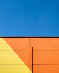 Low angle view of building against blue sky