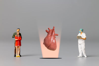 Close-up of figurines against white background