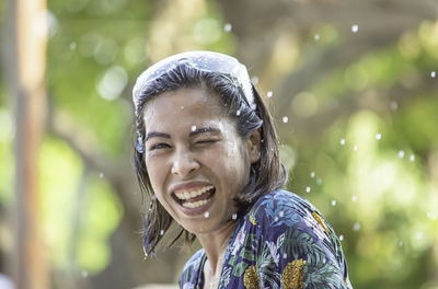 Close-up portrait of smiling young woman