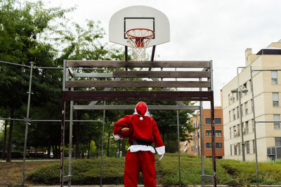 Santa claus looking at the basketball net