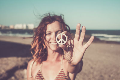 Portrait of young woman on beach