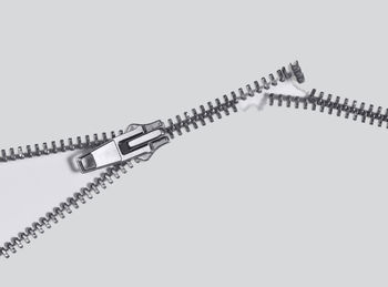 Low angle view of chain against white background