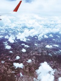 Scenic view of mountain range against cloudy sky