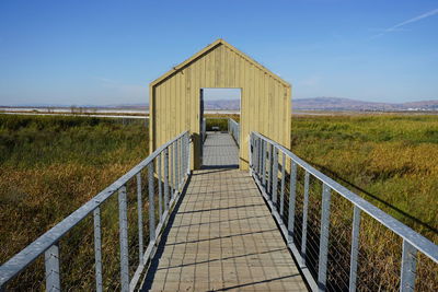 Built structure on field against clear sky