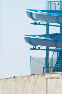 Low angle view of built structure against clear blue sky