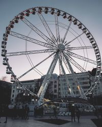 Low angle view of ferris wheel against sky