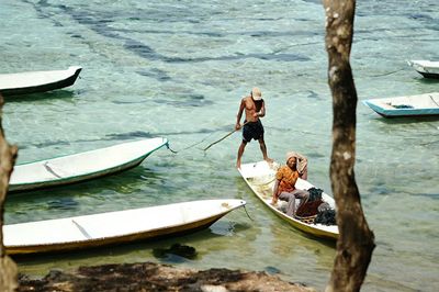 People on boat in sea