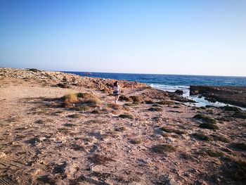 Scenic view of sea against clear blue sky