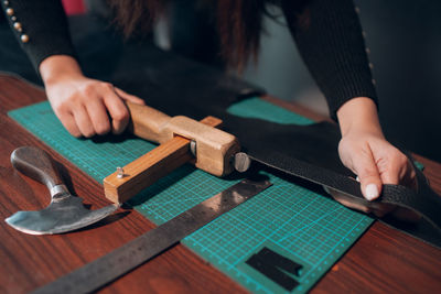 Midsection of man working at table