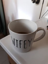 Close-up of coffee cup on table