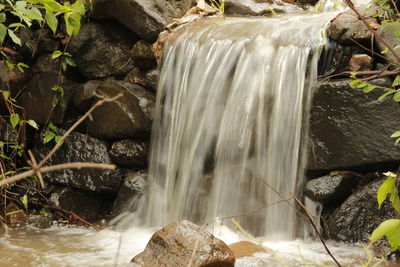 Close-up of water flowing through rocks