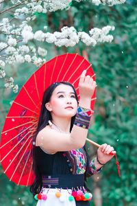 Beautiful young woman looking away