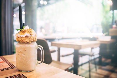 Close-up of coffee served on table at cafe