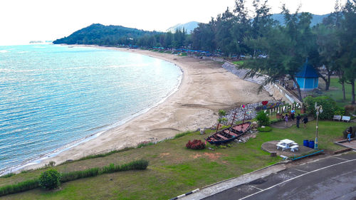 High angle view of road by sea against sky