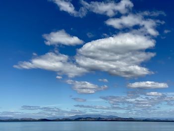 Scenic view of sea against blue sky