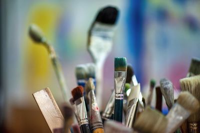 Close-up of paintbrushes on table