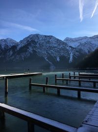 Scenic view of lake and mountains against sky