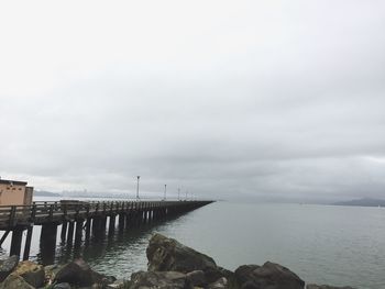 Pier on sea against sky