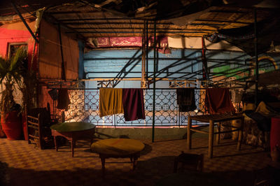 Empty chairs and tables in building