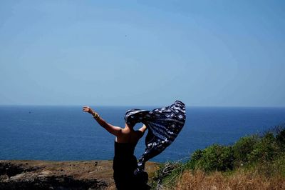 Scenic view of sea against blue sky