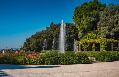 View of fountain against clear blue sky