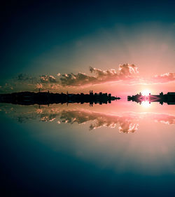 Scenic view of lake against sky during sunset