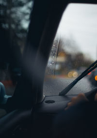 Close-up of wet car window in rainy season