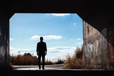 Silhouette of woman against sky