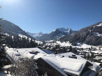 Scenic view of snowcapped mountains against clear sky