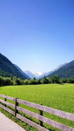 Scenic view of mountains against clear blue sky